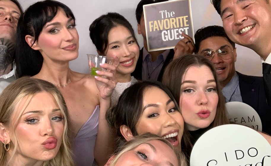 Group smiling and posing in Starry Night Photo Booth