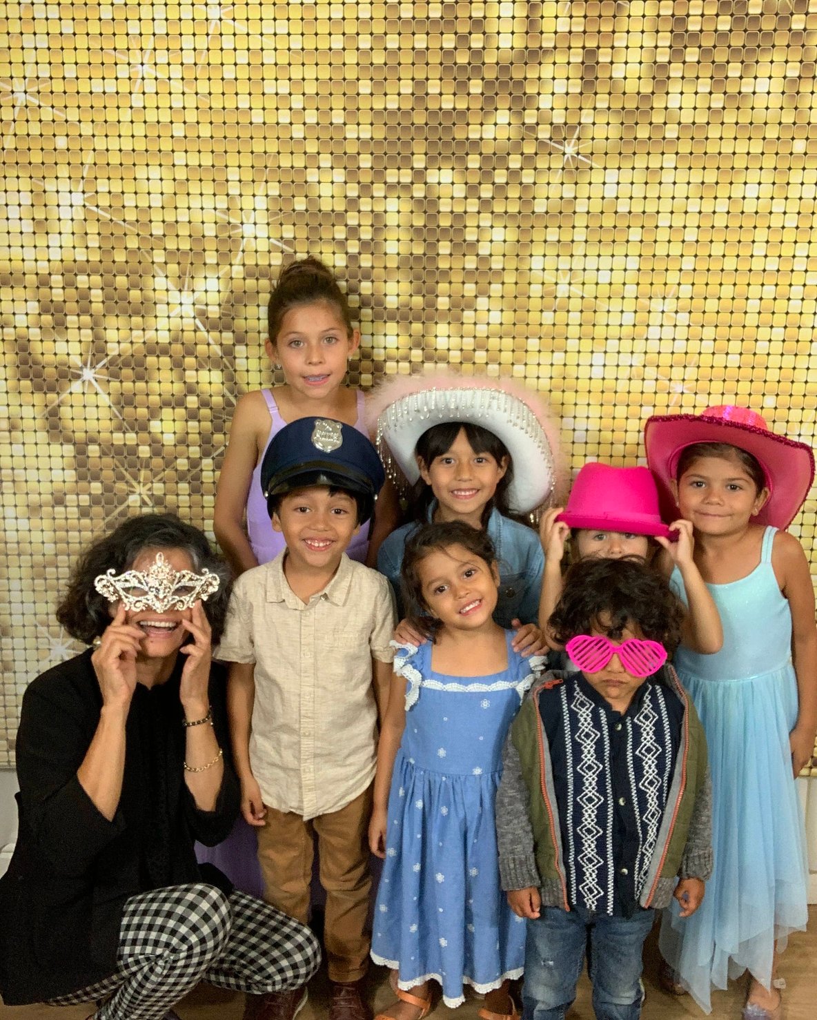 Friends cheering with photo booth props