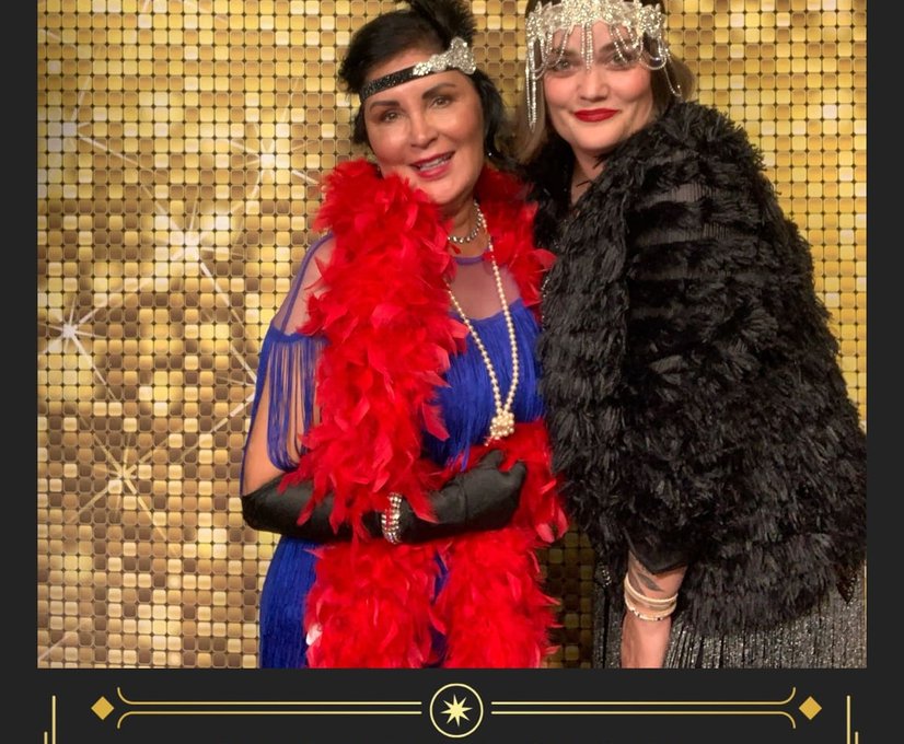 Group photo with photo booth backdrop