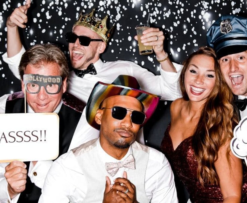 Guests laughing and celebrating in Starry Night Photo Booth
