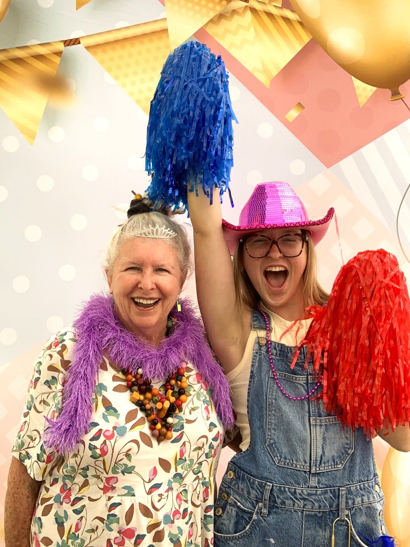 Guests laughing and celebrating in Starry Night Photo Booth